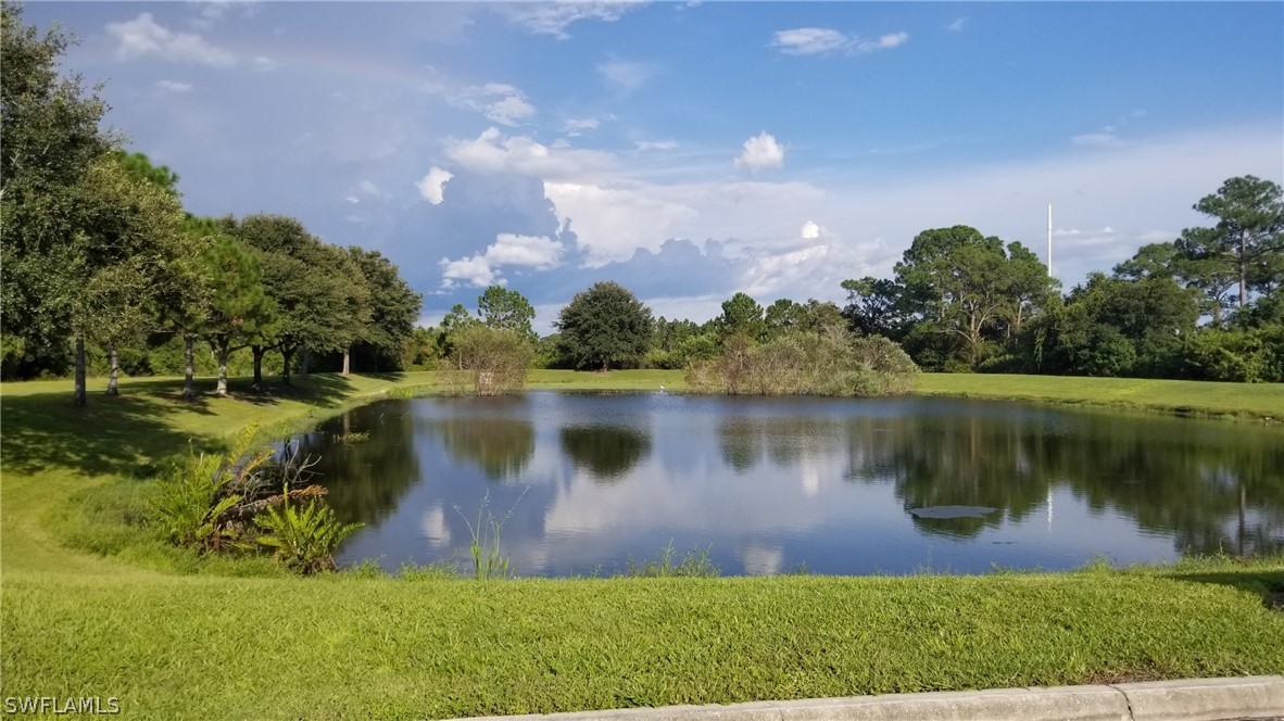 971128607 Embassy Road North Port, FL 34291 - Photo 30 of 43 a view of a lake with a yard