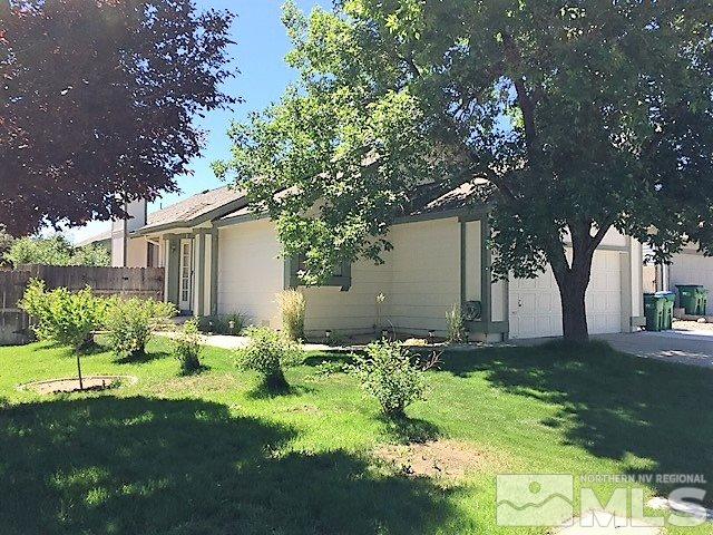 5826 Coyote Ridge Road Reno, NV 89523 - Photo 1 of 1 a backyard of a house with table and chairs
