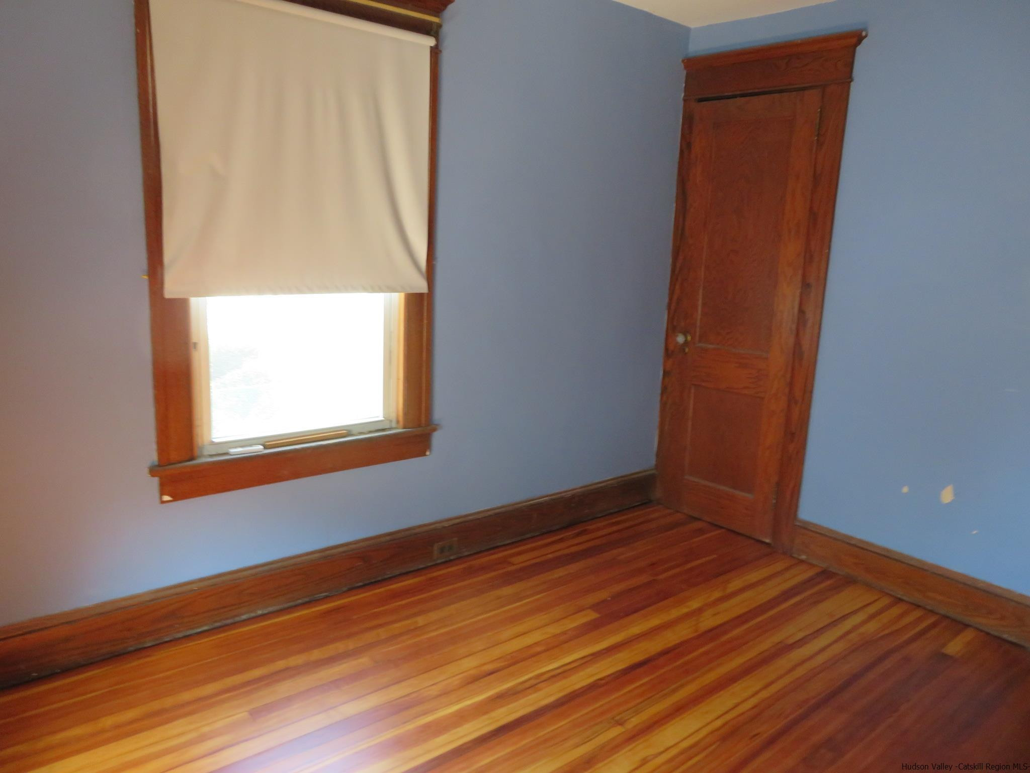 27 Pine Street Kingston, NY 12401 - Photo 21 of 32 an empty room with wooden floor and windows