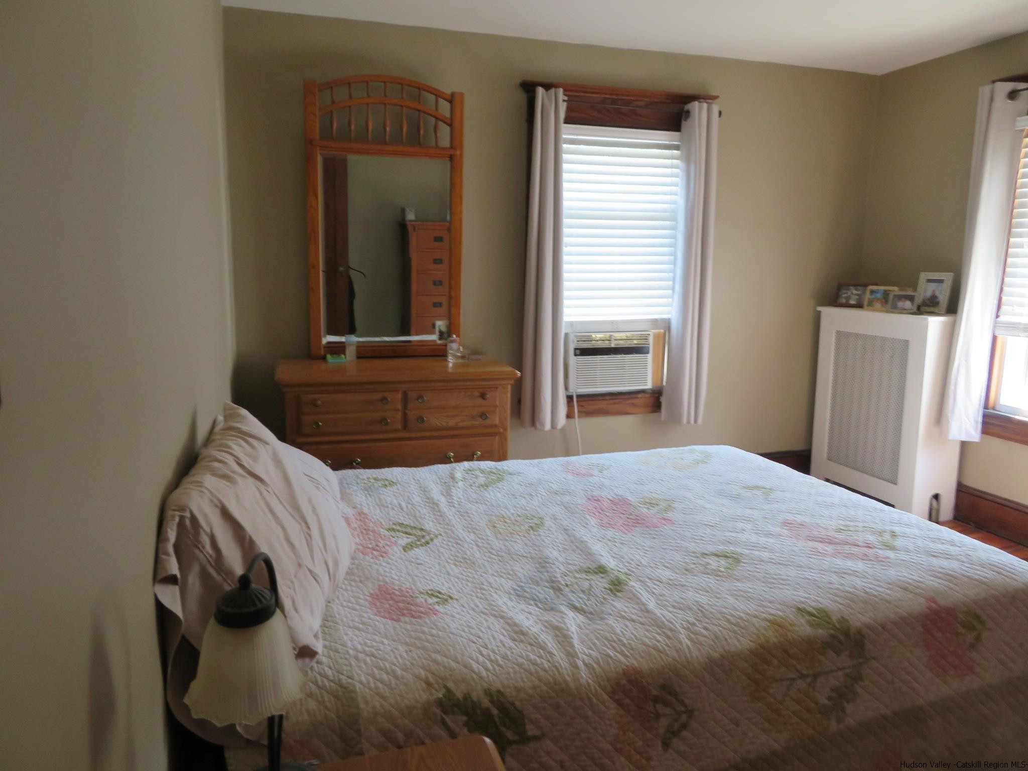 27 Pine Street Kingston, NY 12401 - Photo 27 of 32 a bedroom with a bed and a window