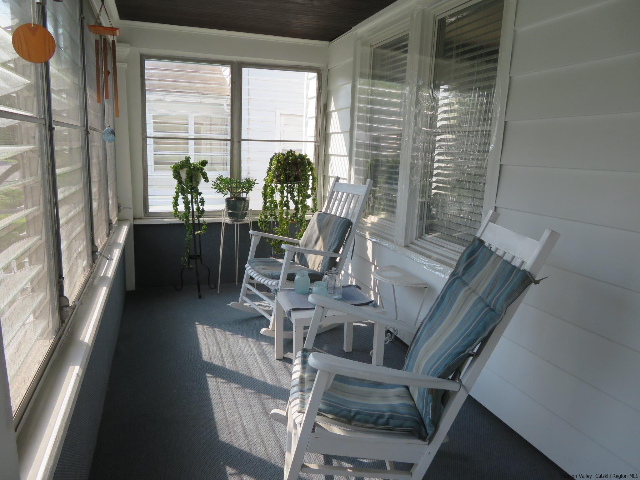 27 Pine Street Kingston, NY 12401 - Photo 5 of 32 a view of a living room with furniture and floor to ceiling windows