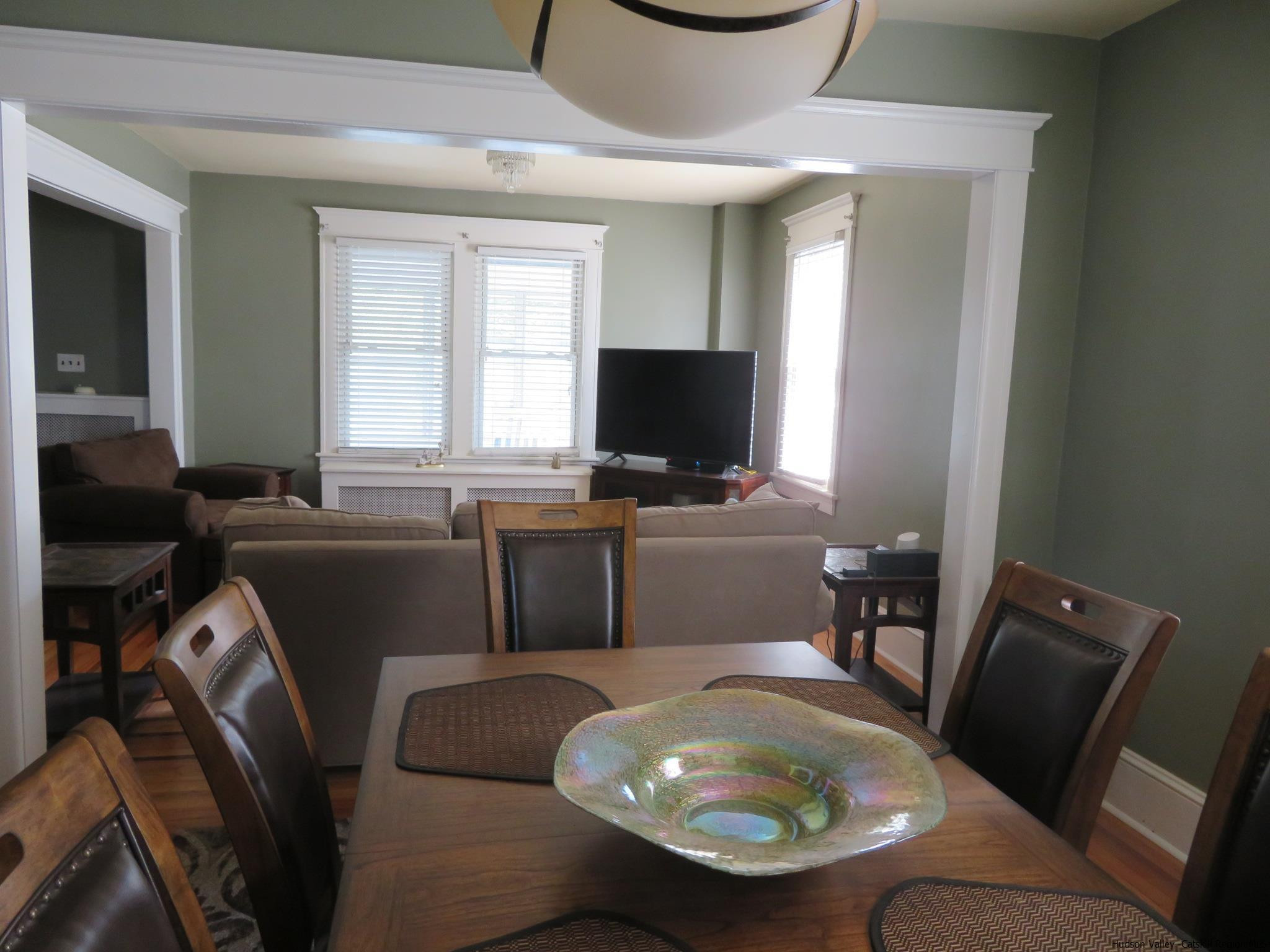 27 Pine Street Kingston, NY 12401 - Photo 10 of 32 a living room with furniture a flat screen tv and a window