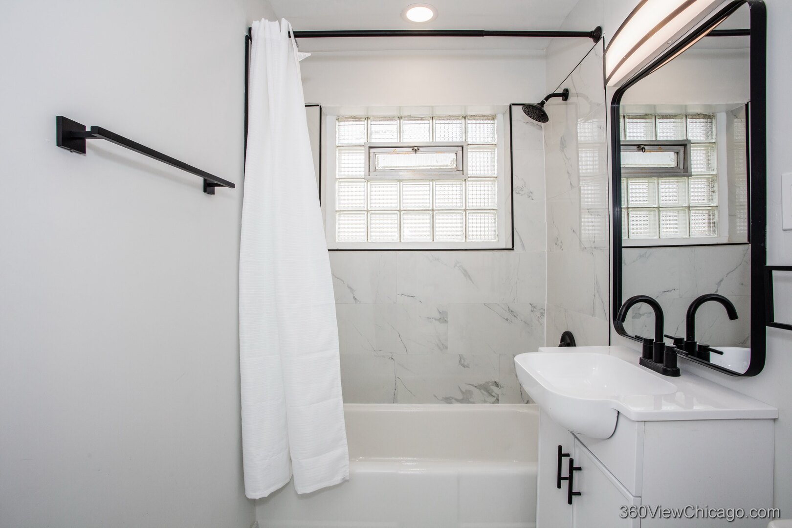 8651 44th Street Lyons, IL 60534 - Photo 15 of 31 a bathroom with a sink and a bathtub