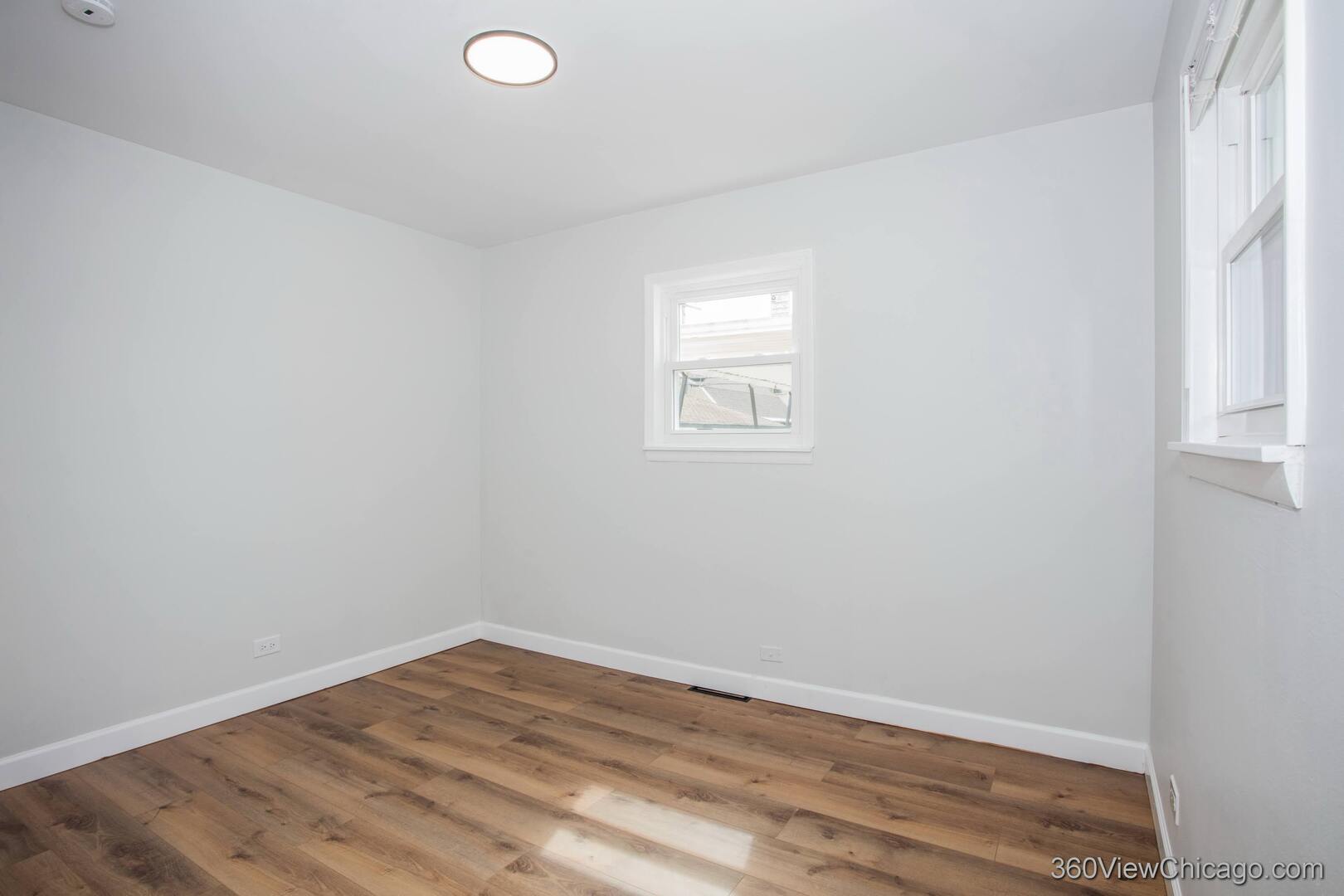 8651 44th Street Lyons, IL 60534 - Photo 19 of 31 an empty room with a window