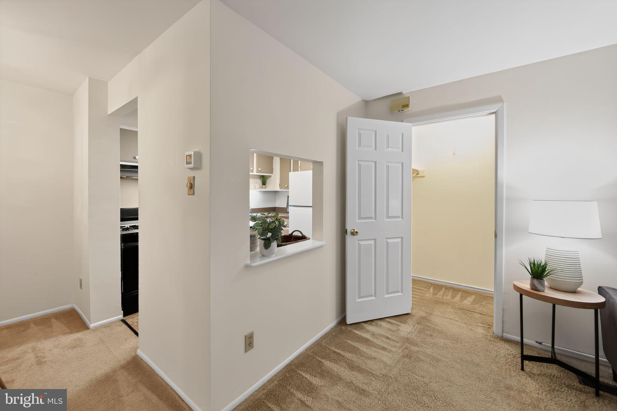 363 Old Forge Crossing, Unit 363 Devon, PA 19333 - Photo 17 of 32 Cut through window from kitchen to LR