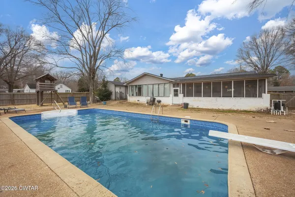 a view of a house with a swimming pool