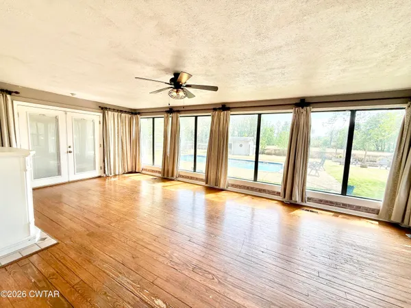 a view of walk in closet and bedroom