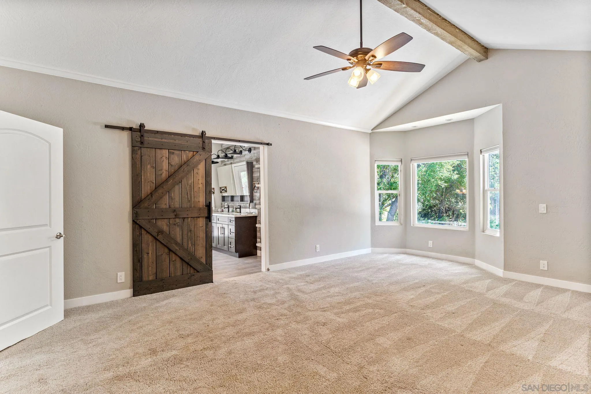 29575 Costalota Road Valley Center, CA 92082 - Photo 14 of 39 a view of a livingroom with a ceiling fan and window