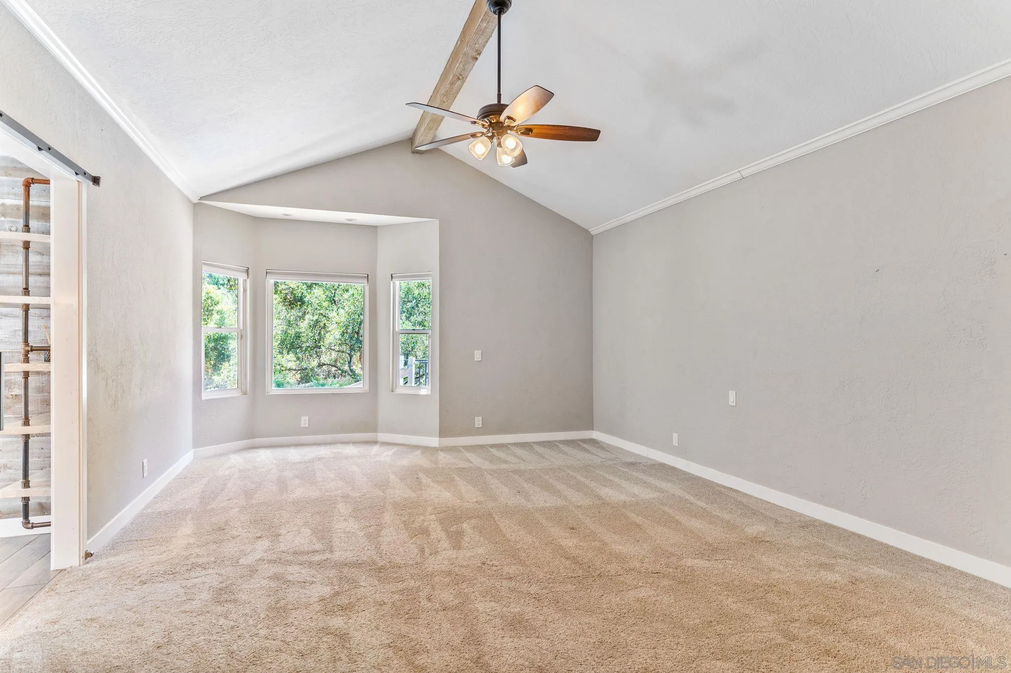 29575 Costalota Road Valley Center, CA 92082 - Photo 15 of 39 a view of a livingroom with a ceiling fan and window