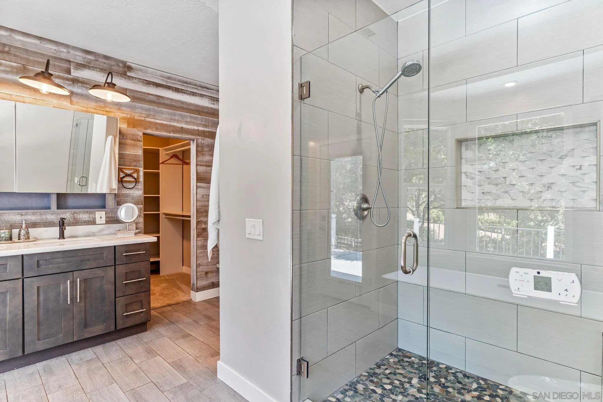 29575 Costalota Road Valley Center, CA 92082 - Photo 17 of 39 a bathroom with a glass shower door and a sink