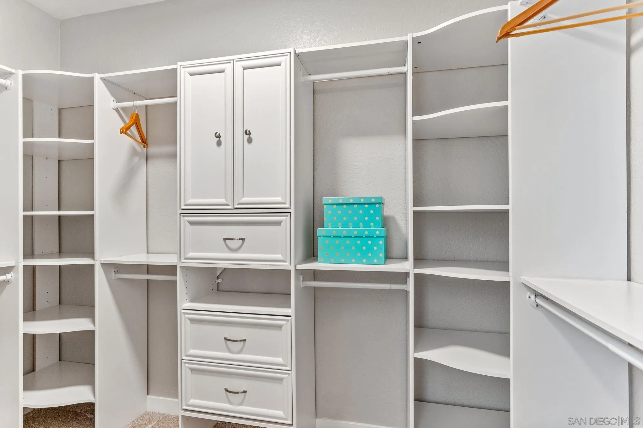 29575 Costalota Road Valley Center, CA 92082 - Photo 19 of 39 a view of walk in closet with empty racks