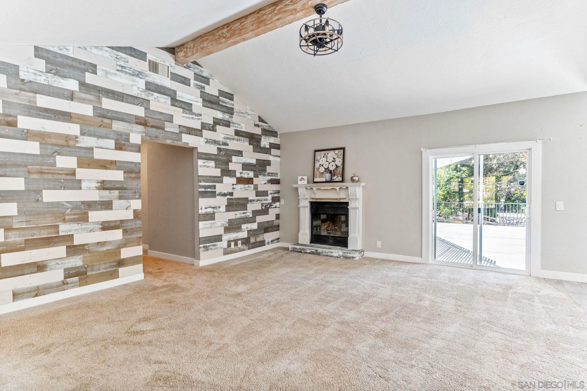 29575 Costalota Road Valley Center, CA 92082 - Photo 5 of 39 a view of an empty room with a fireplace and a window
