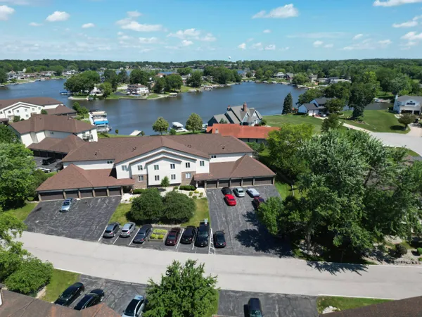 an aerial view of a house with a lake view