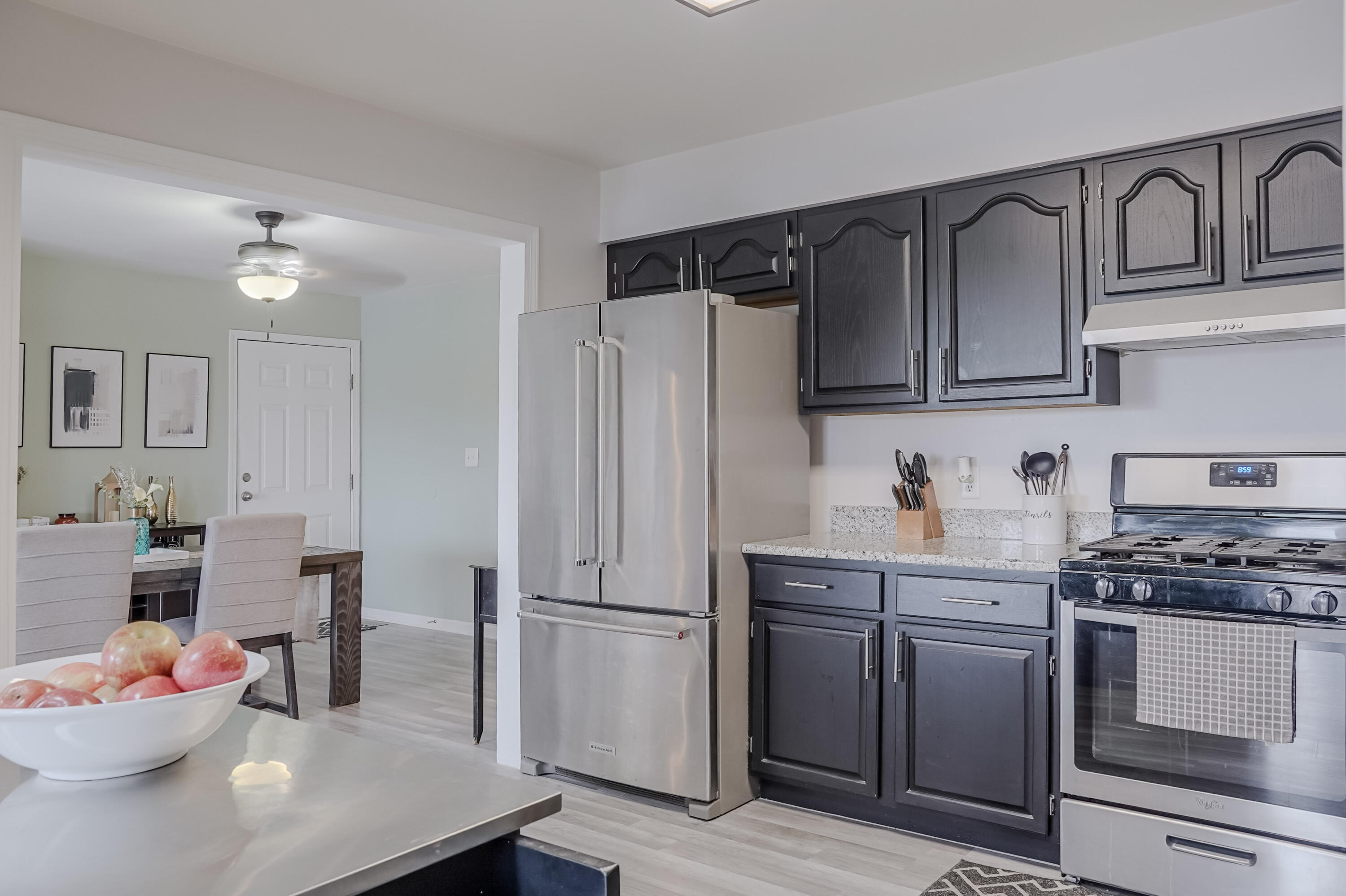 5065 Spinnaker Lane, Unit E Crown Point, IN 46307 - Photo 12 of 43 a kitchen with stainless steel appliances granite countertop a refrigerator stove and sink