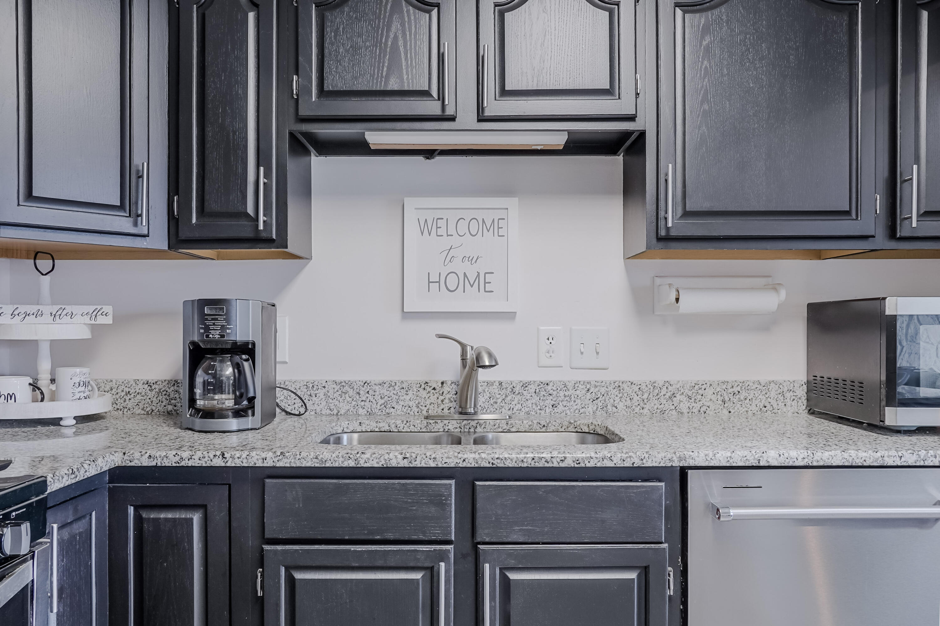 5065 Spinnaker Lane, Unit E Crown Point, IN 46307 - Photo 14 of 43 a kitchen with granite countertop stainless steel appliances sink and cabinets