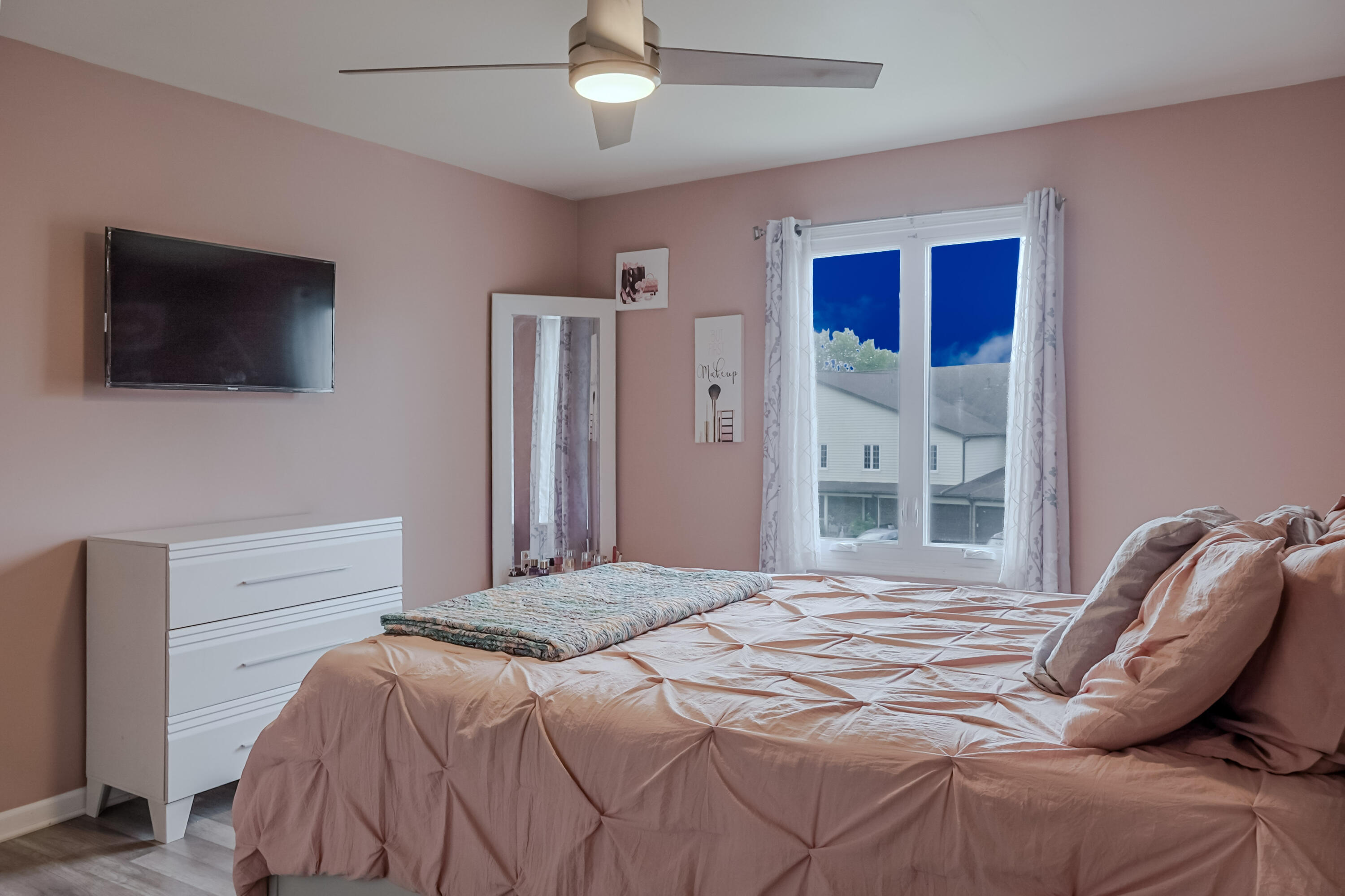5065 Spinnaker Lane, Unit E Crown Point, IN 46307 - Photo 17 of 43 a bedroom with a bed and a flat screen tv