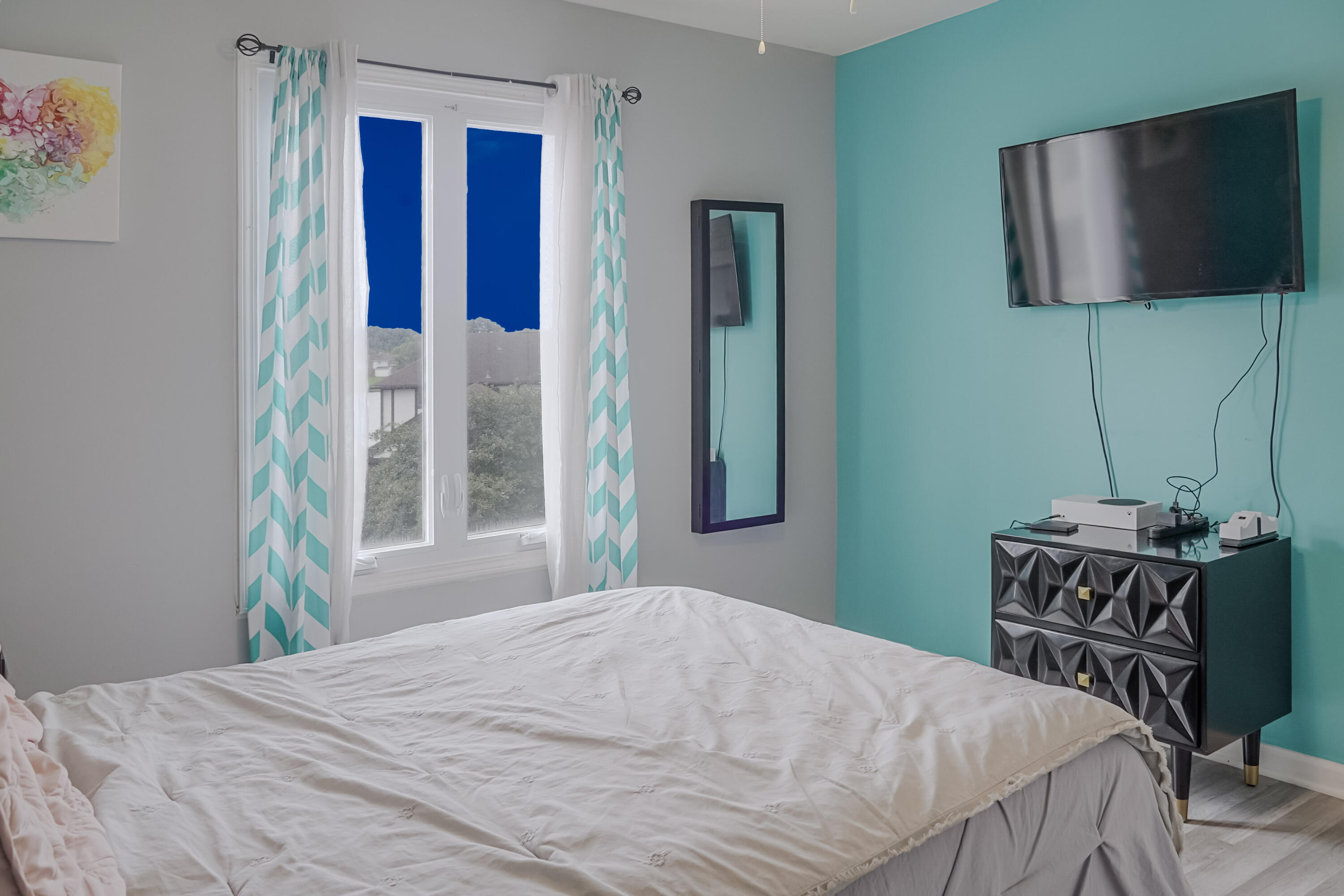 5065 Spinnaker Lane, Unit E Crown Point, IN 46307 - Photo 19 of 43 a bedroom with a bed and flat screen tv
