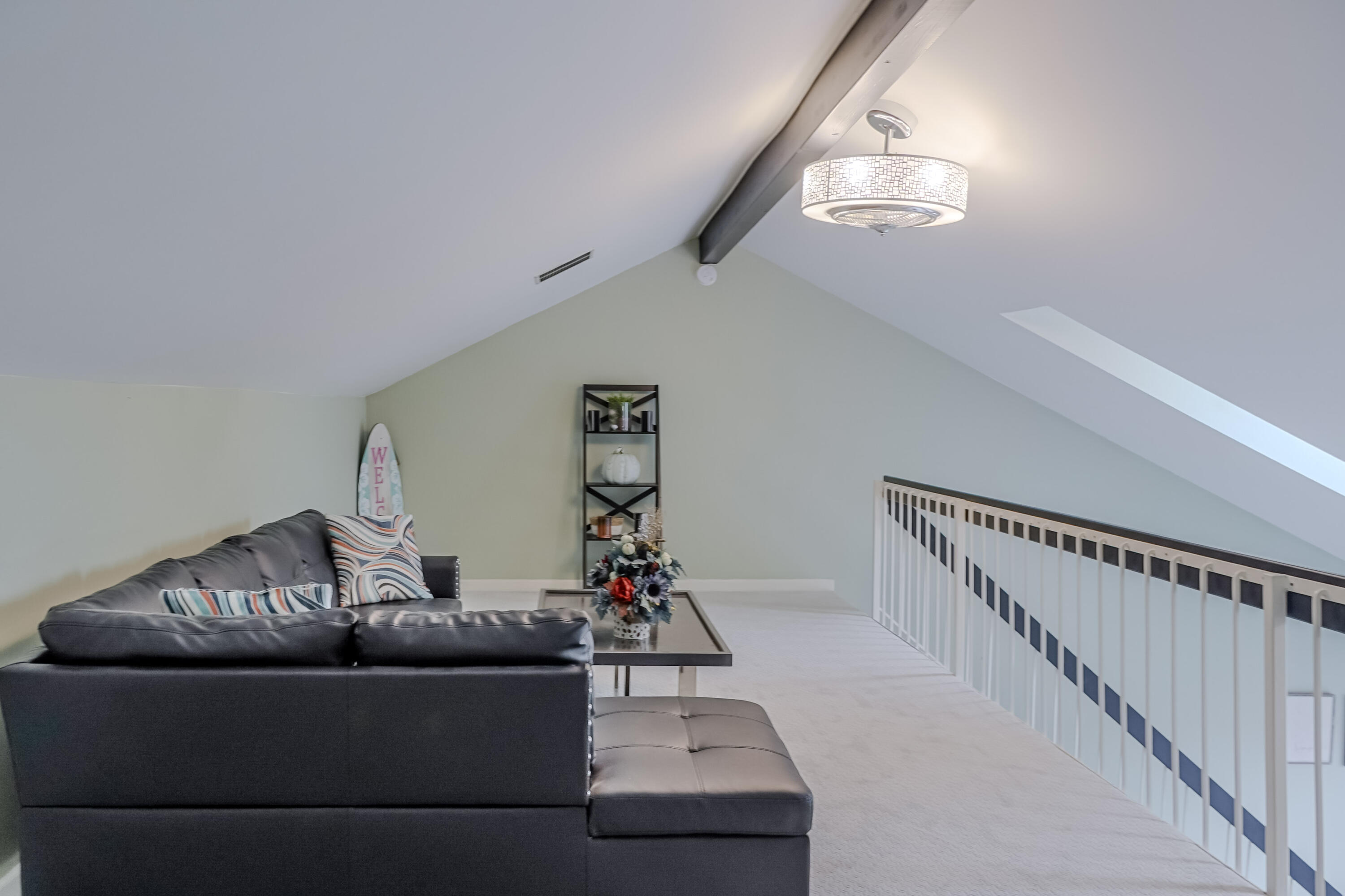 5065 Spinnaker Lane, Unit E Crown Point, IN 46307 - Photo 24 of 43 a living room with furniture and a chandelier