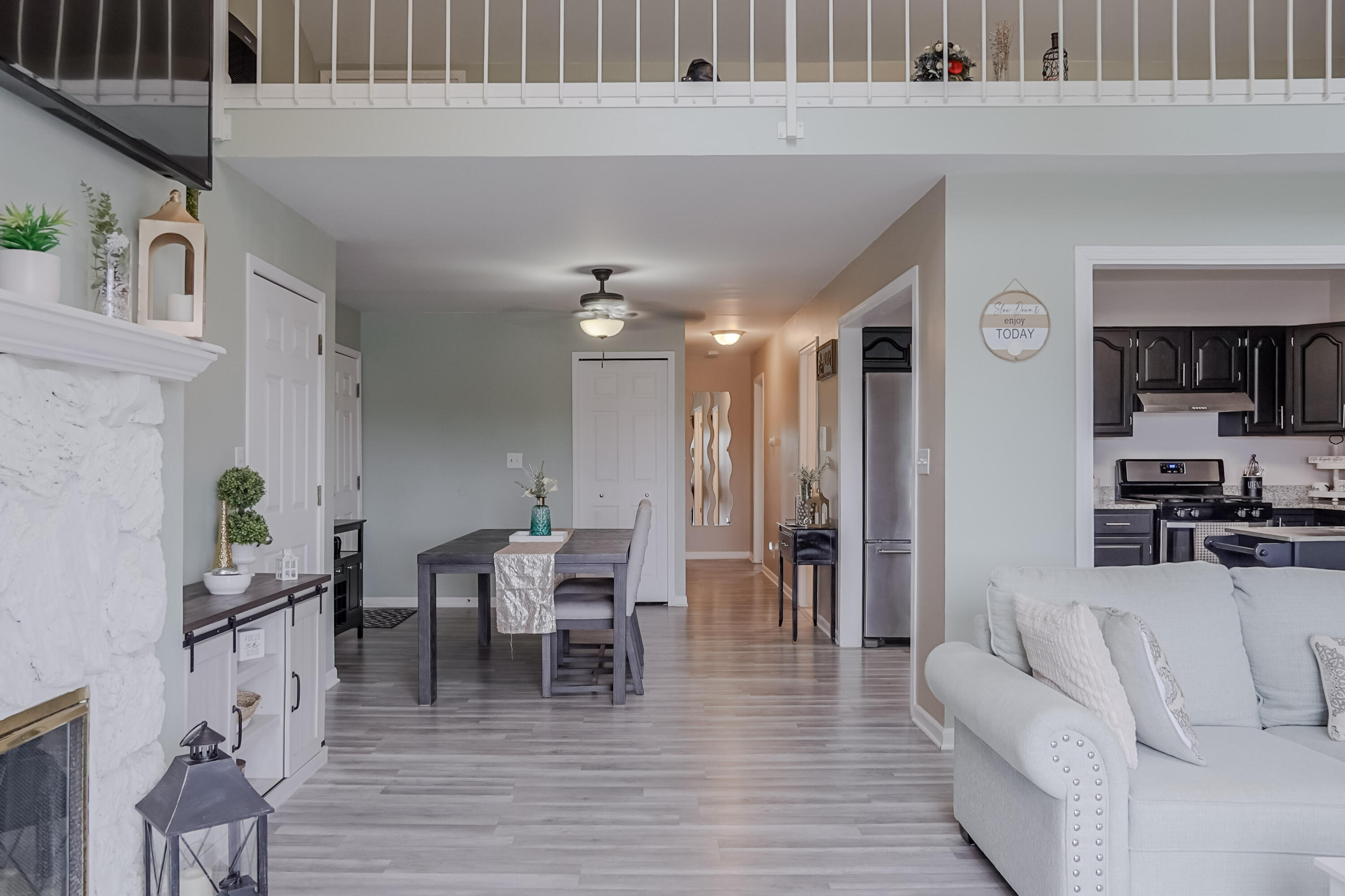5065 Spinnaker Lane, Unit E Crown Point, IN 46307 - Photo 9 of 43 a living room with furniture and a wooden floor