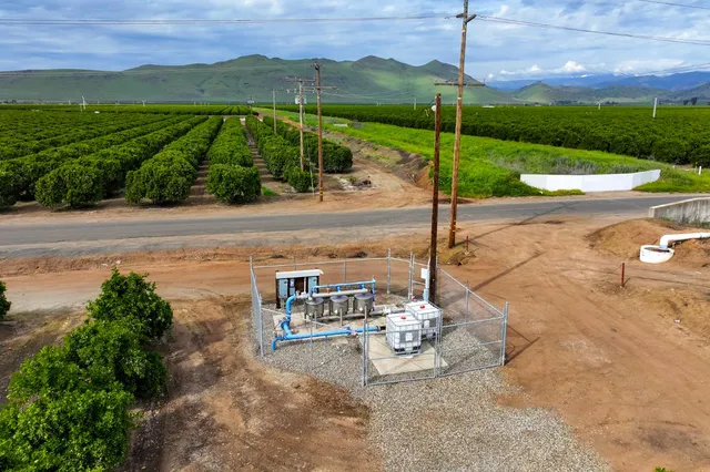 a view of a street with a big yard