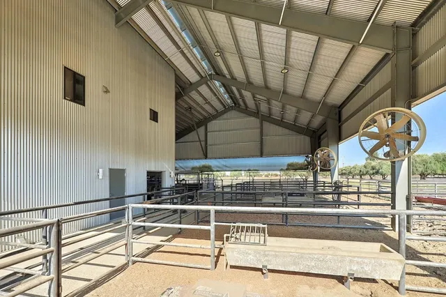 a kitchen with stainless steel appliances kitchen island granite countertop a sink and cabinets