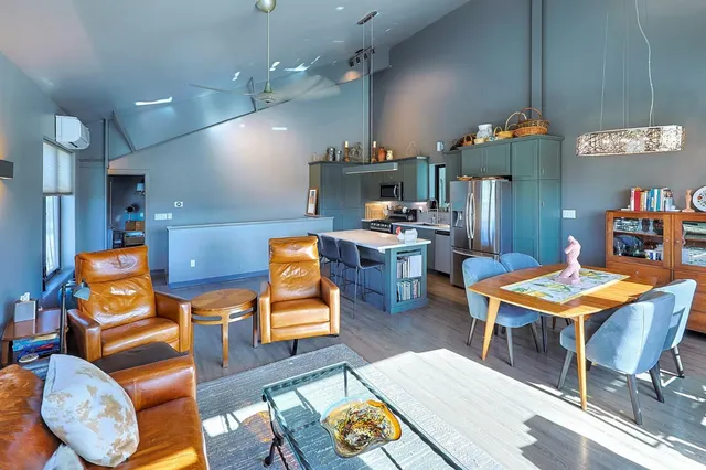 a bedroom with a bed furniture and a window