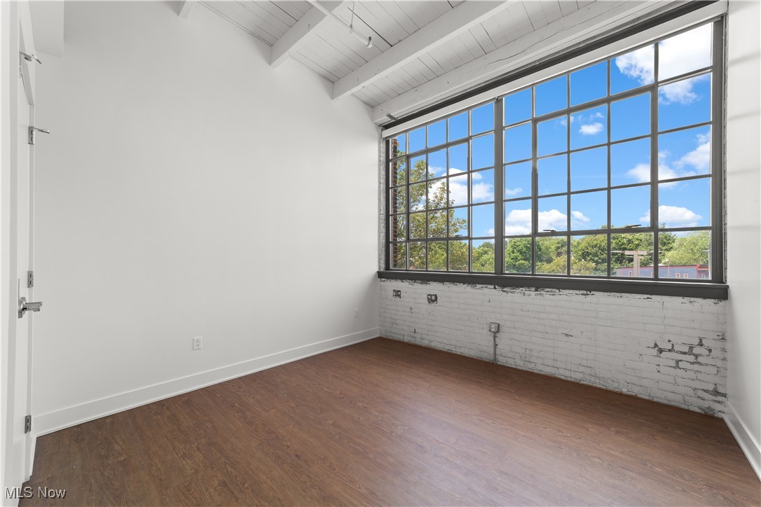 2048 Fulton Road, Unit 107 Cleveland, OH 44113 - Photo 29 of 37 Sunny bedroom with ten foot tall industrial style windows