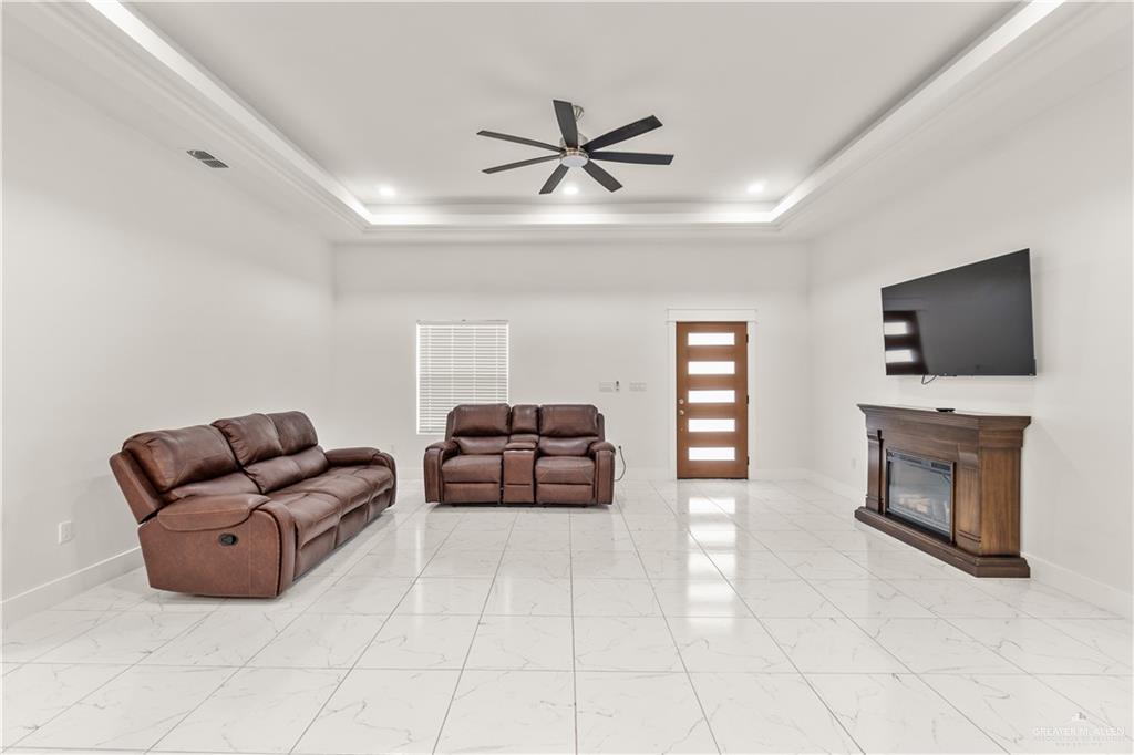 23232 Val Verde Road Edcouch, TX 78538 - Photo 3 of 19 a living room with furniture and a flat screen tv