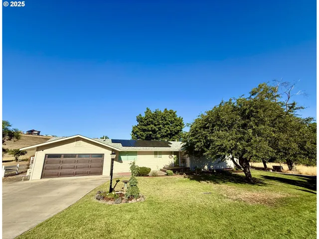 a house with trees in the background