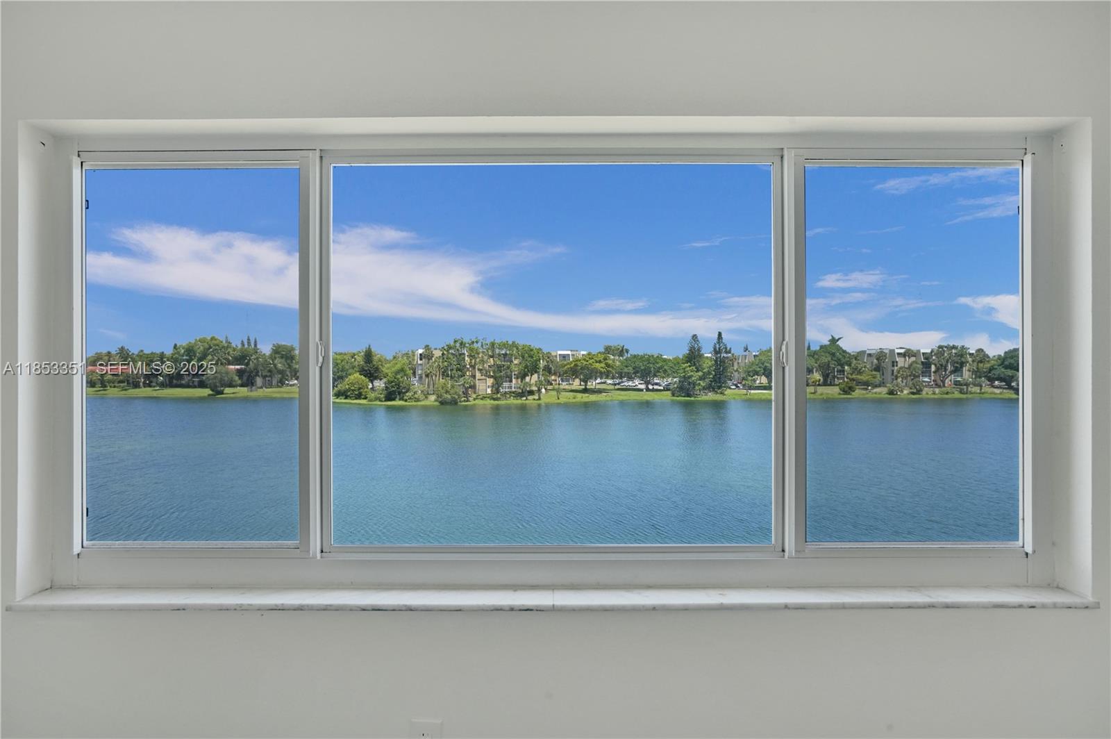 873 Northeast 195th Street, Unit 309 North Miami Beach, FL 33179 - Photo 25 of 35 a view of window