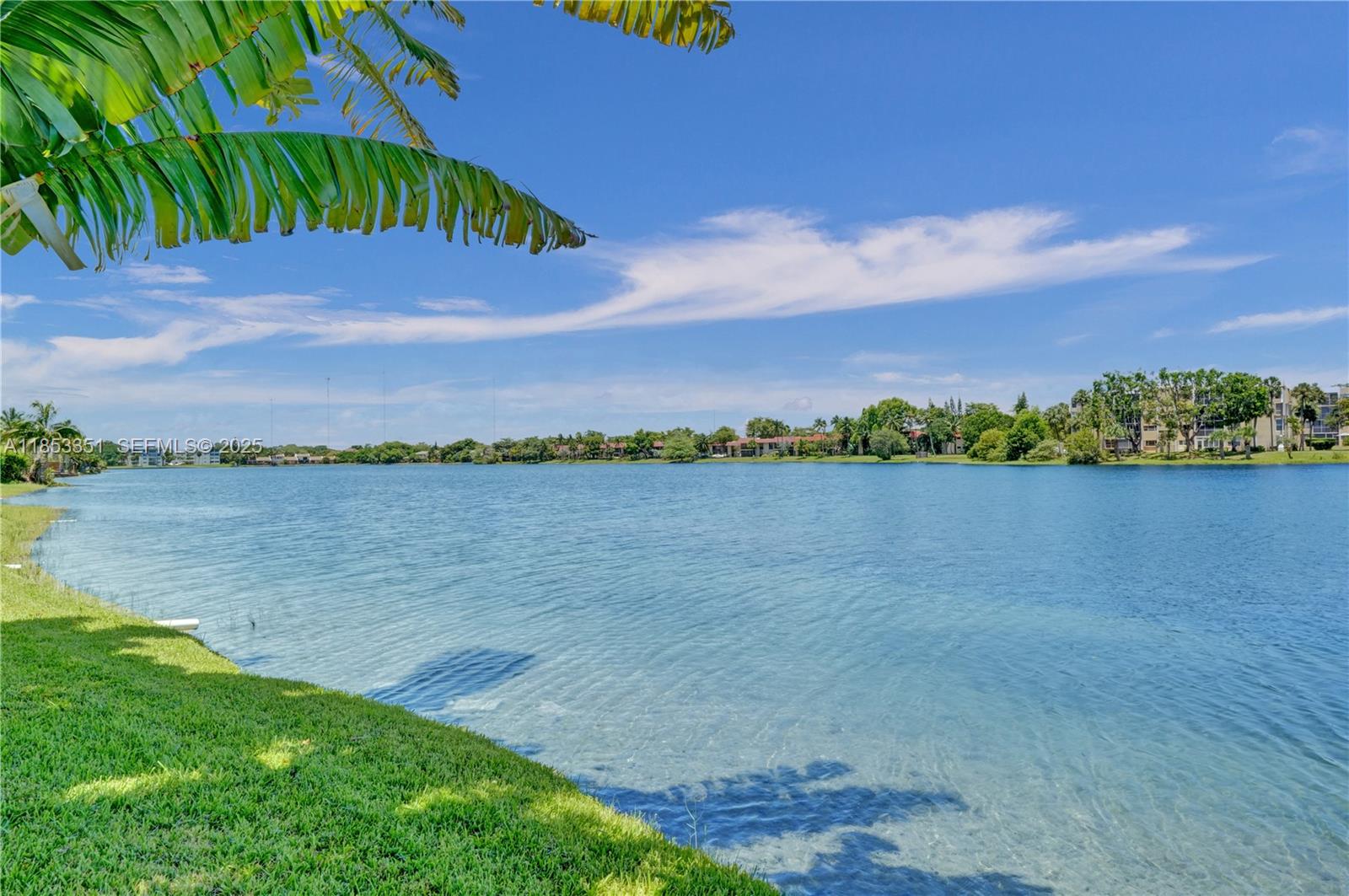 873 Northeast 195th Street, Unit 309 North Miami Beach, FL 33179 - Photo 28 of 35 a view of a lake