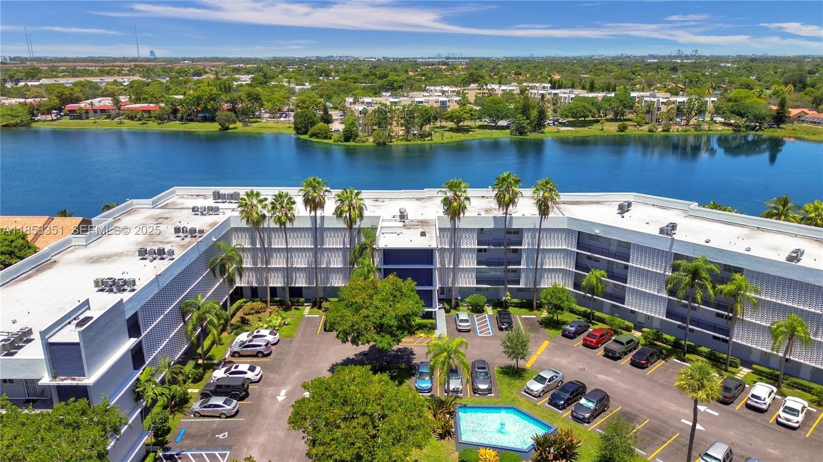873 Northeast 195th Street, Unit 309 North Miami Beach, FL 33179 - Photo 3 of 35 aerial view of a city and lake view