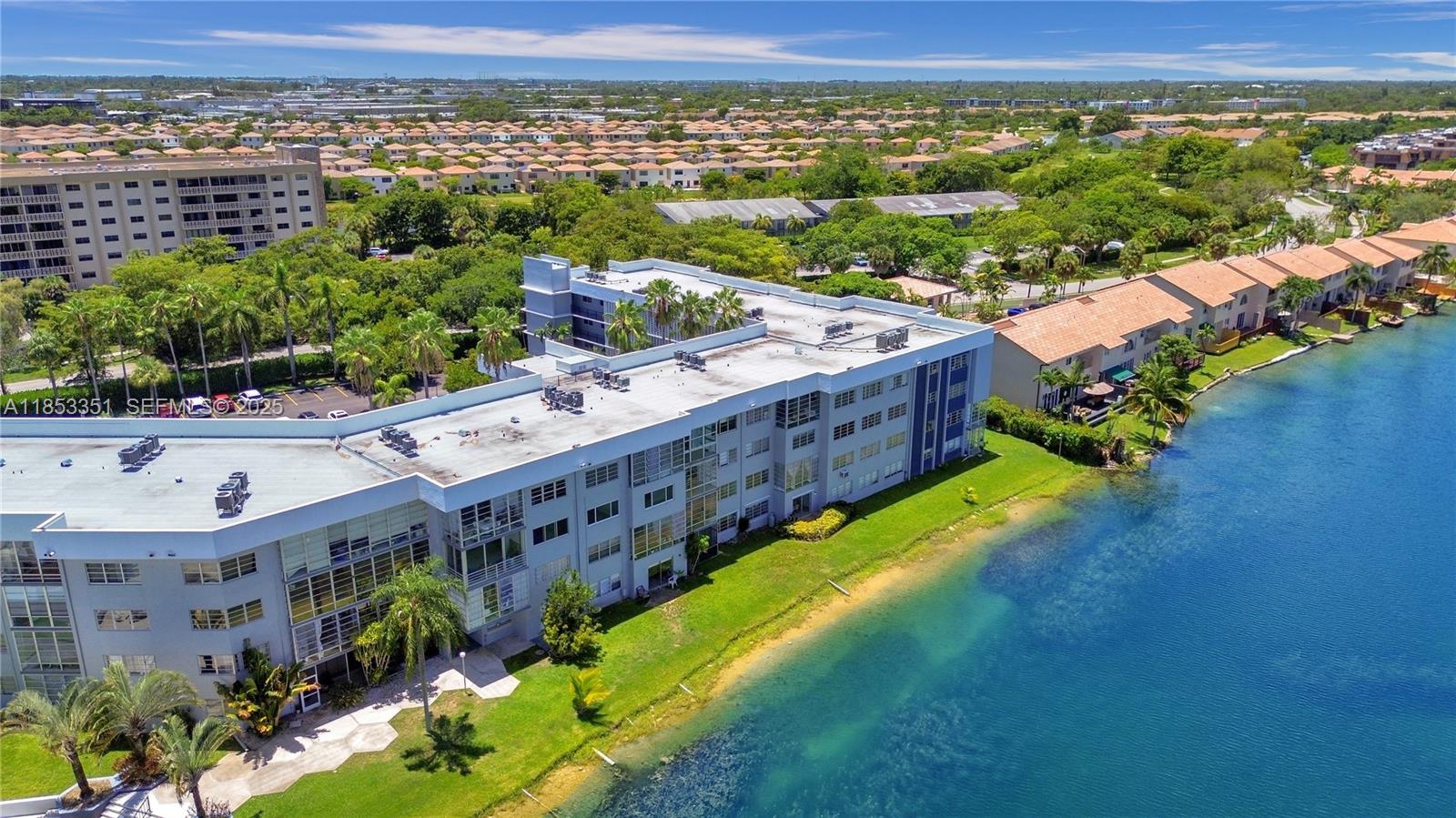 873 Northeast 195th Street, Unit 309 North Miami Beach, FL 33179 - Photo 31 of 35 a view of a city and an ocean