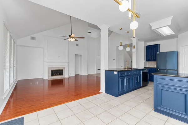 a kitchen with a sink a counter space cabinets and appliances