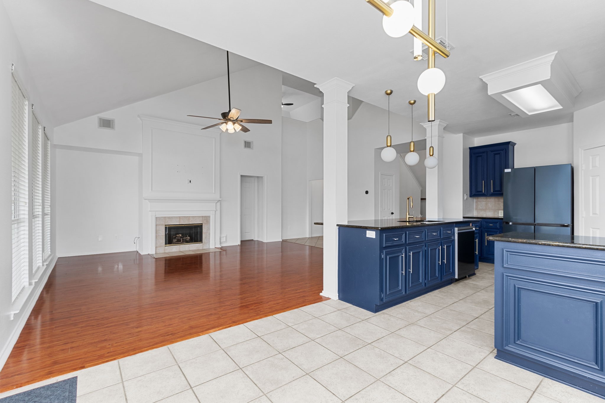 16202 Lasting Light Lane Houston, TX 77095 - Photo 14 of 36 a large kitchen with kitchen island granite countertop a stove a sink and a refrigerator