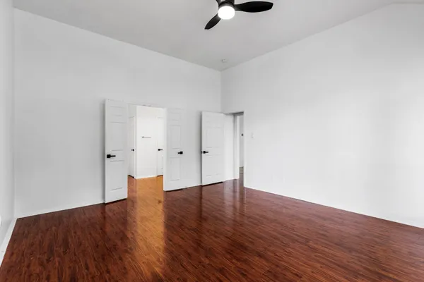 a spacious bathroom with a sink and a mirror