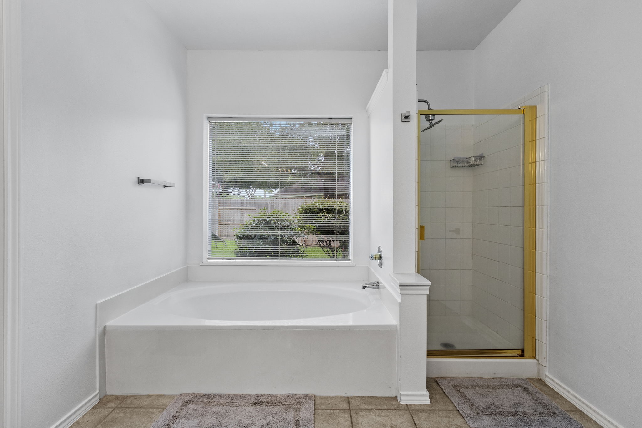 16202 Lasting Light Lane Houston, TX 77095 - Photo 21 of 36 a bathroom with a bathtub and shower