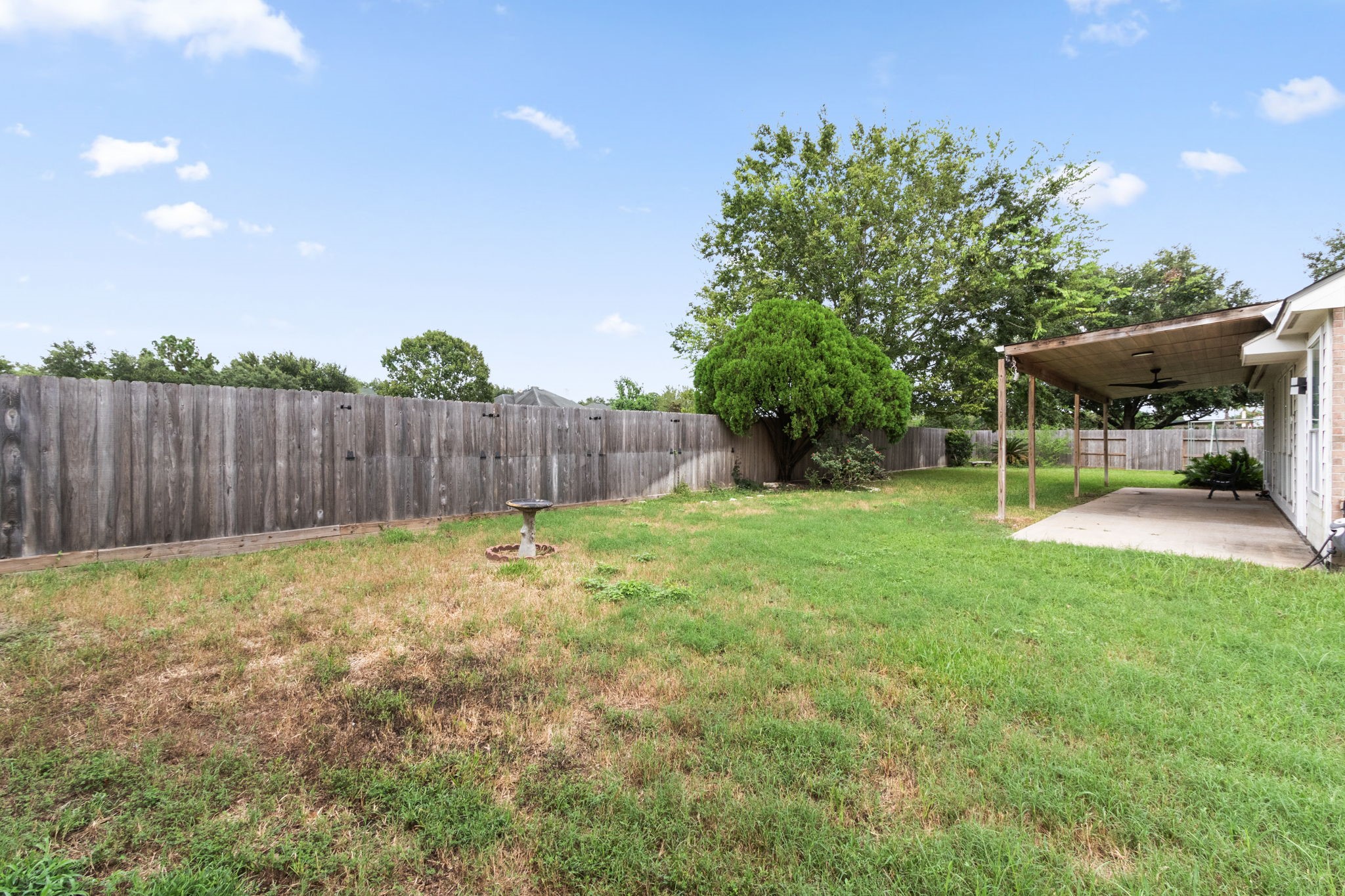 16202 Lasting Light Lane Houston, TX 77095 - Photo 36 of 36 a view of a backyard with a garden and entertaining space