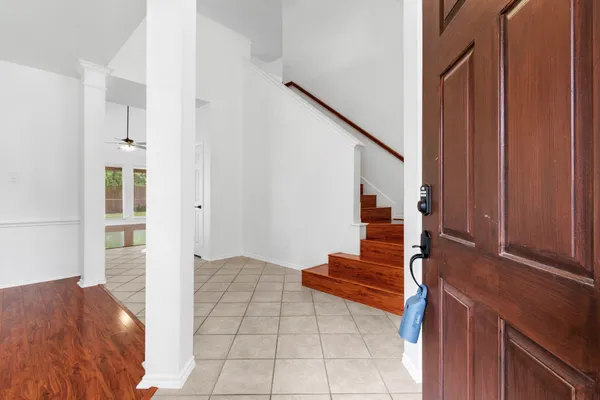 a view of an entryway with wooden floor