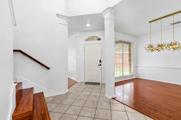 a view of a room with window and wooden floor