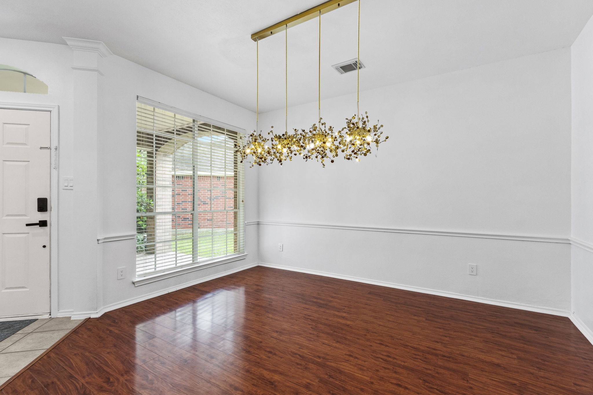 16202 Lasting Light Lane Houston, TX 77095 - Photo 8 of 36 a view of a room with window and wooden floor