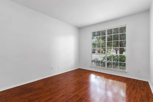 a view of a kitchen with furniture a ceiling fan and window