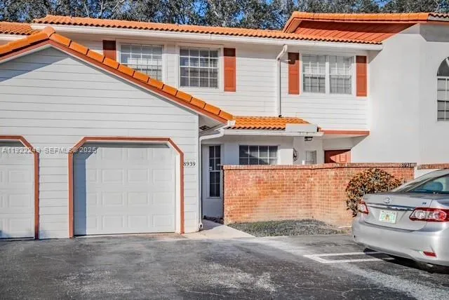a front view of a house with garage