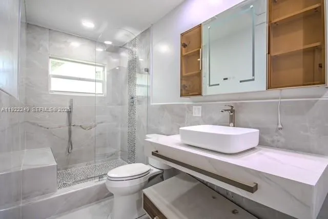 a view of swimming pool with a lawn chairs under an umbrella