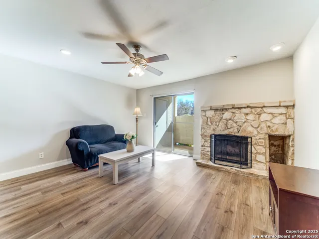 a living room with furniture and a fireplace