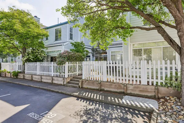 a view of a house with a small yard