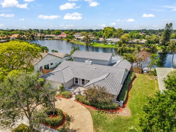 an aerial view of a house with a lake view
