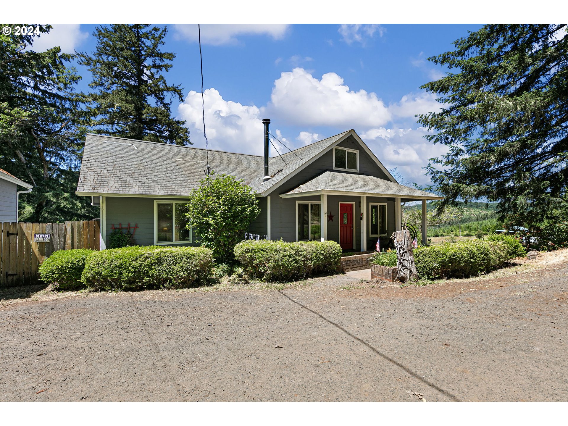 6551 Elkhead Road Yoncalla, OR 97499 - Photo 1 of 39 a front view of house with yard and green space