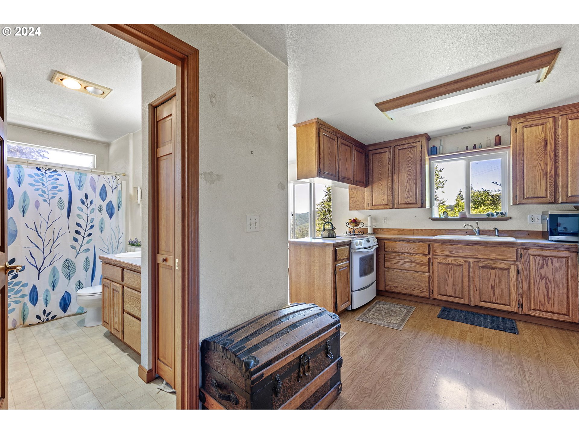 6551 Elkhead Road Yoncalla, OR 97499 - Photo 11 of 39 a kitchen with sink refrigerator and window