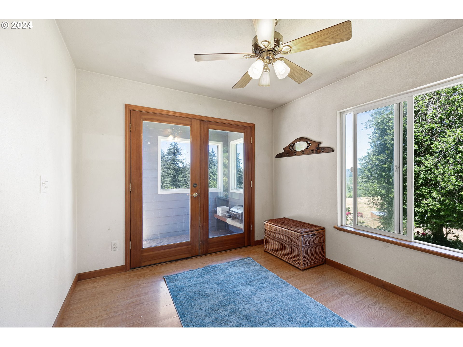 6551 Elkhead Road Yoncalla, OR 97499 - Photo 16 of 39 a living room with furniture and a large window